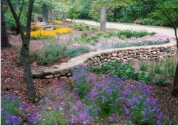 Low Curved river rock low stone wall